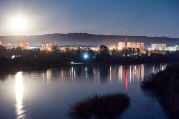 Naklejka premium City landscape in the light of the moon.