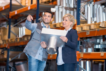 portrait of man and woman in warehouse