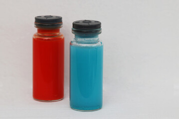 Two multicolored ampoules with the drug against the virus.