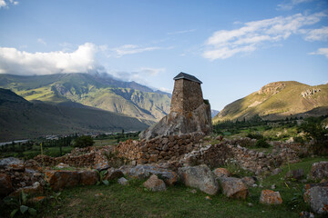 Fototapeta na wymiar Amirkhan Tower - a unique historical building in the village of Upper Bakaria in summer