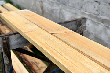 Pine white construction boards at the sawmill