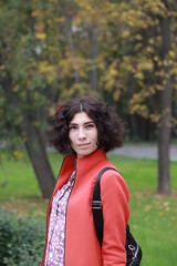 Portrait of young fashionable romantic woman in autumn park