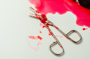 Halloween party decoration, fake blood stain with bloody medical scissors