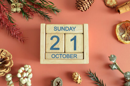 October 21, Cover design with calendar cube, pine cones and dried fruit in the natural concept.