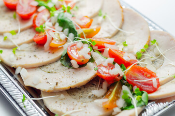 Sliced chicken breast cooked and butter roasted with pork, sage and onion stuffing