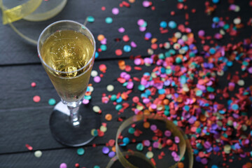 Glass of champagne and confetti