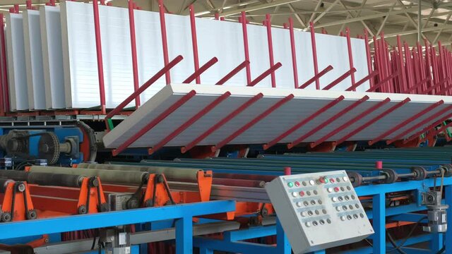 Production conveyer line of metal at modern metalwork Industry factory. Automated industrial machine processing metallurgical products, equipment, manufacturing, Galvanized steel sheet, roof, facade