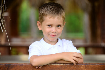 Portrait of young smiling boy in outdoors. - 459301310