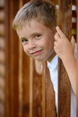 Portrait of young smiling boy in outdoors. - 459301319