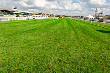 Stratford, Warwickshire, UK – September 2021. The final furlong and finish straight of Stratford horse racing course. Captured on a bright and sunny day