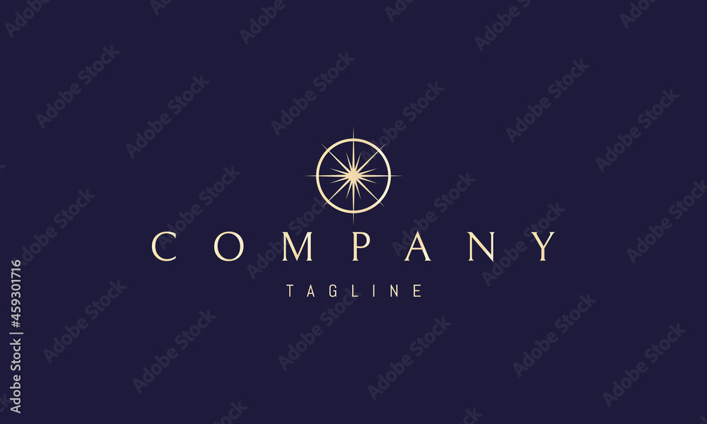 Wall mural vector golden logo on which an abstract image of a bright star in a circle in the form of a compass.