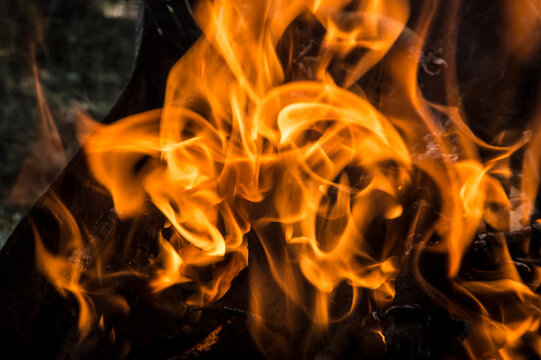 close-up: fire flames in the outdoors grill box for barbeque