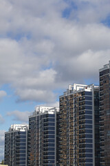 Construction of modern multi-storey buildings. Construction of a new city block. Buildings under construction are visible.