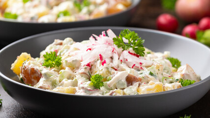 Potato salad with celery, green onion, radish, dill and eggs
