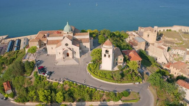 4k drone flight moving to the side footage (Ultra High Definition) of Cattedrale di San Ciriaco church and San Gregorio Illuminatore - Catholic church. Summer cityscape of Ancona town, Italy, Europe.