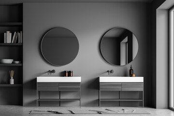 Dark grey bathroom wall with two round mirrors over two vanities