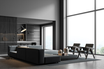 Corner of dark grey panoramic living room with background kitchen