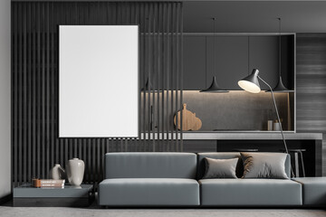 Canvas on wood panel partition wall with sofa and dark grey kitchen