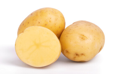 Group of whole and sliced raw potatoes isolated on white background close up
