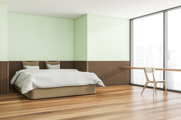 Corner view of trendy light green bedroom