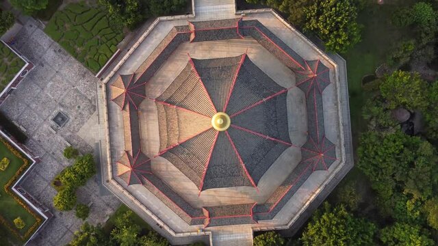 Drone view of pagoda with the characteristic Chinese architecture and modern city in the background