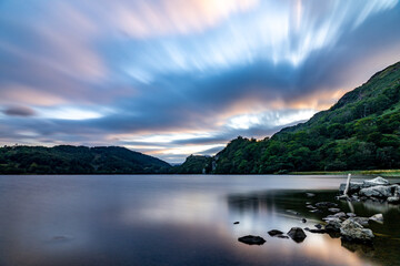 Llyn Gwynant is a lake in Snowdonia, Wales. The lake is natural, having been formed by glacial action and is 120 acres (50 hectares) in size. It is a popular place for canoeing and kayaking.