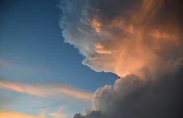 Fototapeta na wymiar Giant cumulonimbus cloud with sunlight and blue sky background