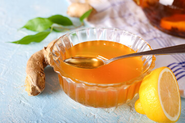 Tea, lemon, honey and ginger healthy on the light background