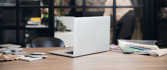 Banner Interior designer workplace. laptop, tile sets and colored set of fabrics for furniture