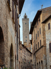 Fototapeta na wymiar Details of Bell Towers and Brick Houses in San Gimignano in Tuscany, Siena - Italy