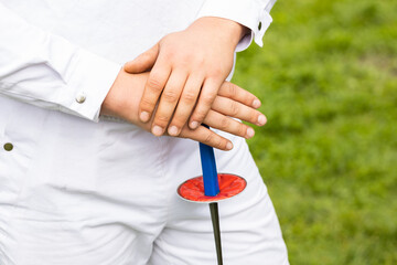 A swordsman dressed in white and holding a sword