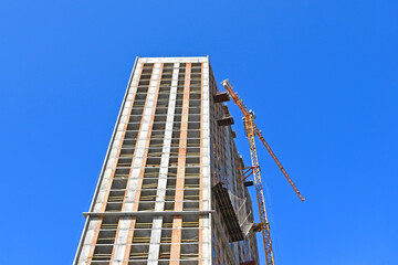 Crane and highrise construction site