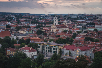 Fototapeta na wymiar VIlnius / Lithuania - August 12 2021: View over the Old Town of Vilnius in summer at sunsetsunrise, amazing baltic touristic city in Lithuania, Europe