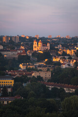 Fototapeta premium VIlnius / Lithuania - August 12 2021: View over the Old Town of Vilnius in summer at sunsetsunrise, amazing baltic touristic city in Lithuania, Europe