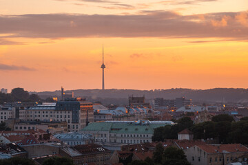 VIlnius / Lithuania - August 12 2021: View over the Old Town of Vilnius in summer at sunset, amazing baltic touristic city in Lithuania