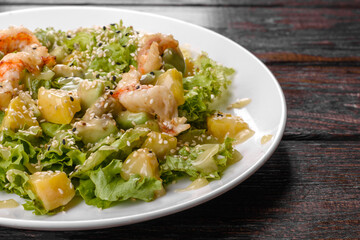 Delicious fresh salad with shrimp and pear for the festive table