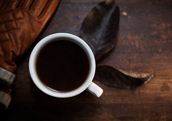 closeup photo of cup of black coffee on a rustic table - 459323330