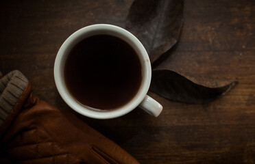 closeup photo of cup of black coffee on a rustic table - 459323343