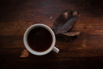 closeup photo of cup of black coffee on a rustic table - 459323377