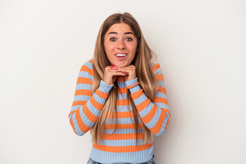 Young Russian woman isolated on white background praying for luck, amazed and opening mouth looking to front.