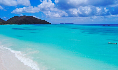 A gorgeous advertising view of the ocean coastline. Seychelles with white sand and blue lagoon