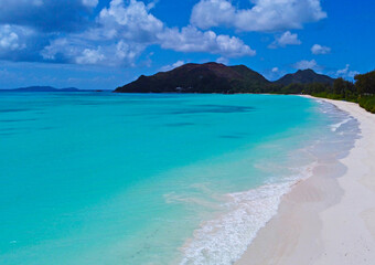 A gorgeous advertising view of the ocean coastline. Seychelles with white sand and blue lagoon