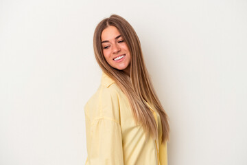 Obraz premium Young Russian woman isolated on white background looks aside smiling, cheerful and pleasant.