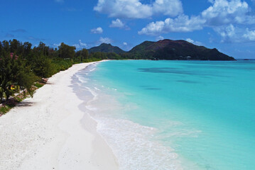 A gorgeous advertising view of the ocean coastline. Seychelles with white sand and blue lagoon