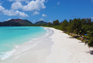 A gorgeous advertising view of the ocean coastline. Seychelles with white sand and blue lagoon