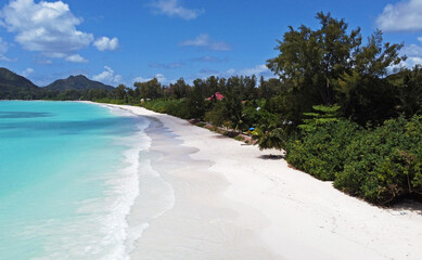 A gorgeous advertising view of the ocean coastline. Seychelles with white sand and blue lagoon