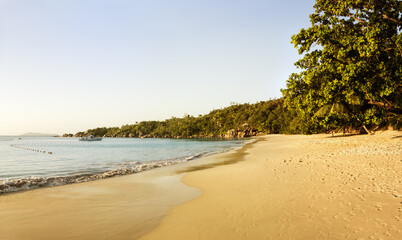 White coral beach sand and azure indian ocean.