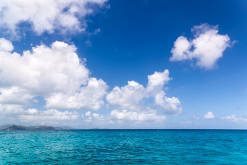 Fototapeta na wymiar Seascape Sunny day. Blue sky and blue water.