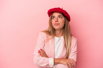 Fototapeta premium Young Russian woman isolated on pink background showing number two with fingers.