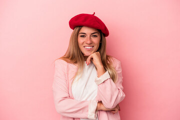 Young Russian woman isolated on pink background cheering carefree and excited. Victory concept.